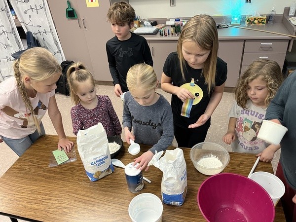 students making playdough for study buddies