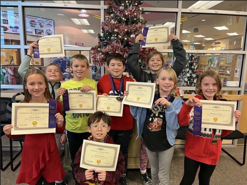 students holding certificates
