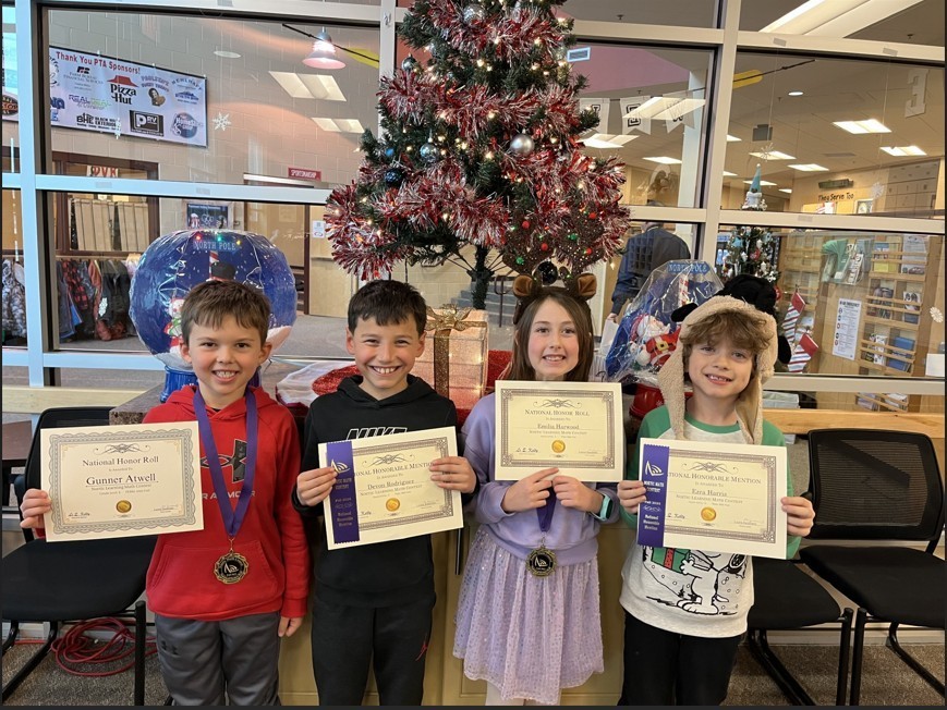 students holding certificates