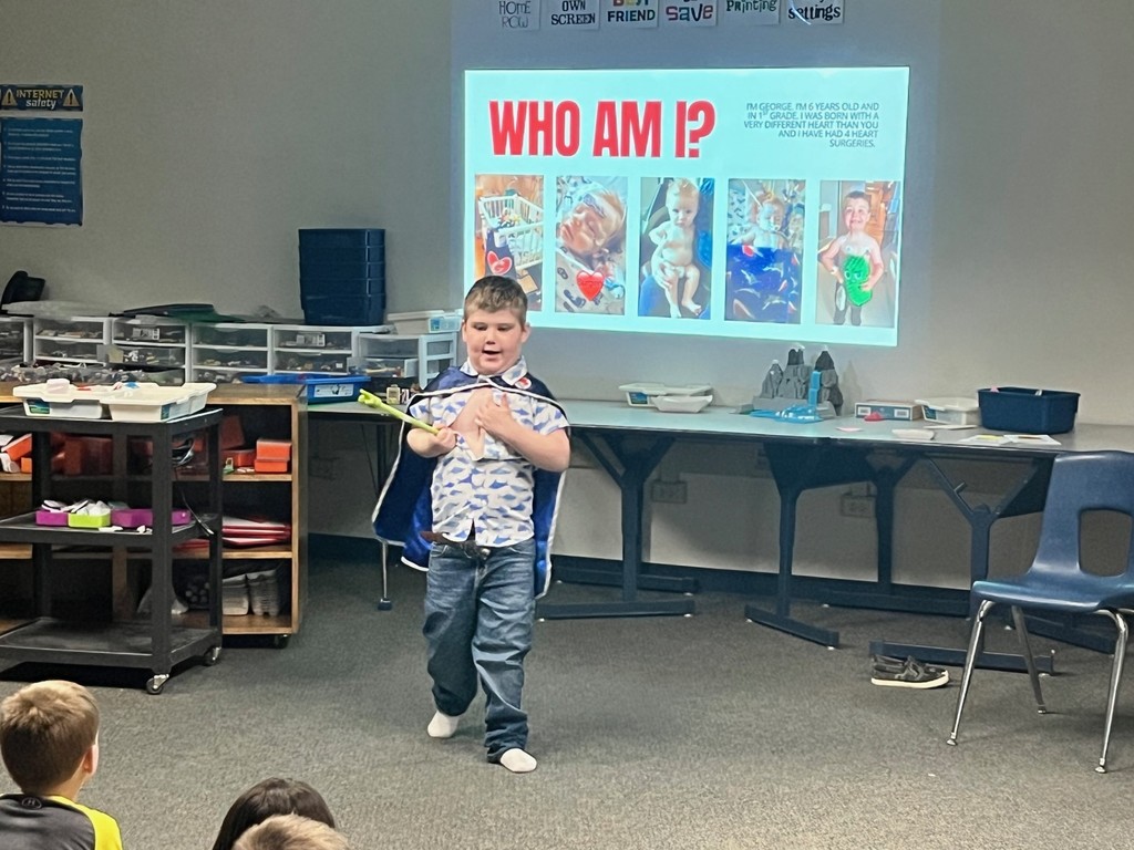 George presenting about his heart to the class