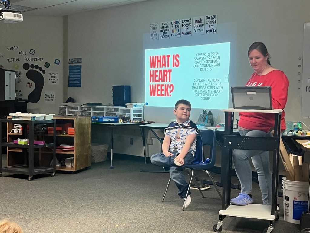 George presenting about his heart to the class