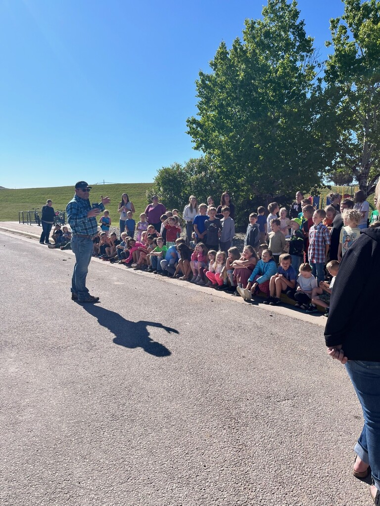 tom price talking to students before the helicopter flies in