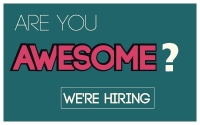 ARE YOU (white) Awesome (pink) ? (white) WE'RE HIRING (white, with a white thin box around the words) The writing is on a greenish/blueish background.