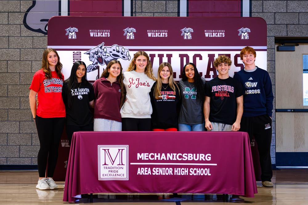 A group of student athletes on signing day.
