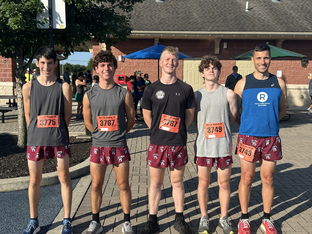 Five men in shirts and matching Wildcat shorts.