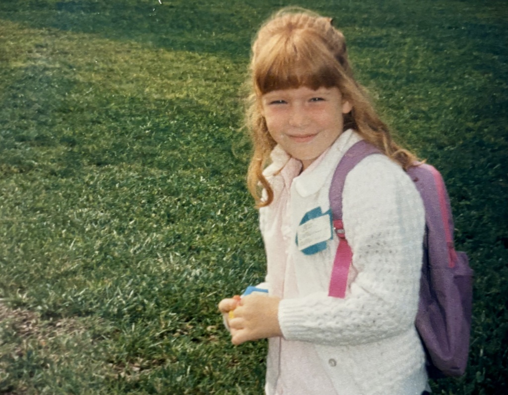 Young girl on first day of school