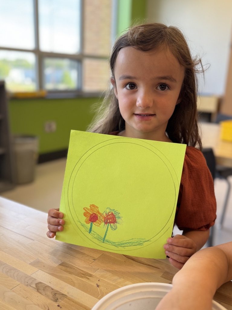 Students drawing dots in art class