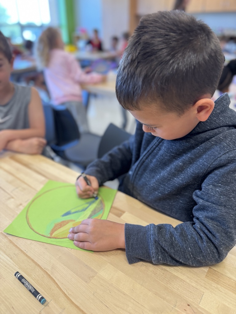 Students drawing dots in art class