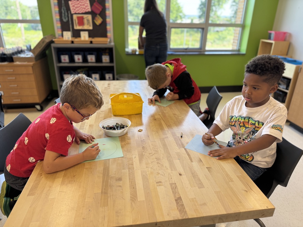 Students drawing dots in art class