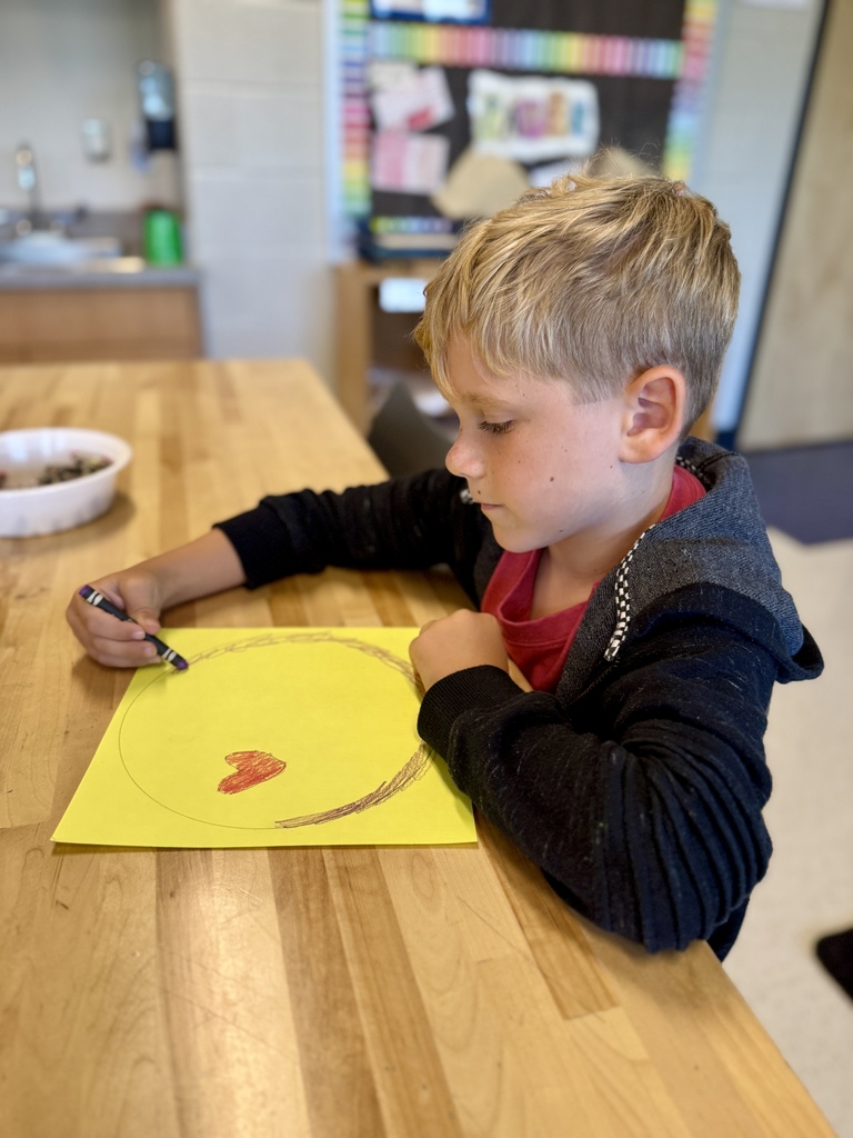 Students drawing dots in art class