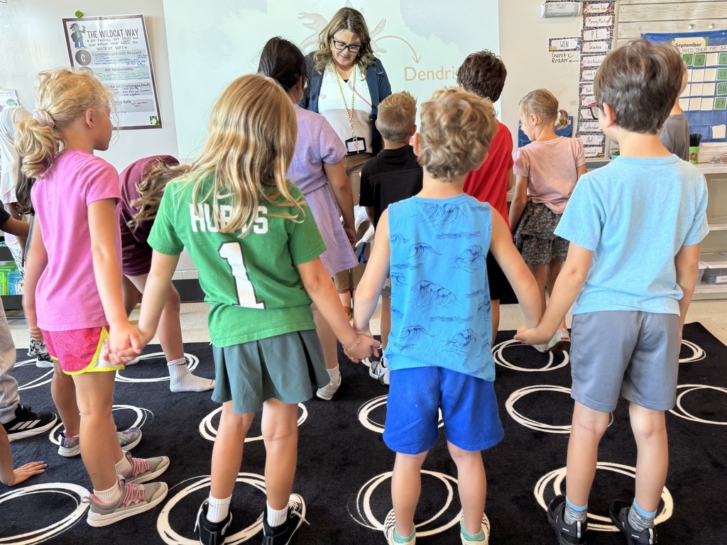 Students holding hands