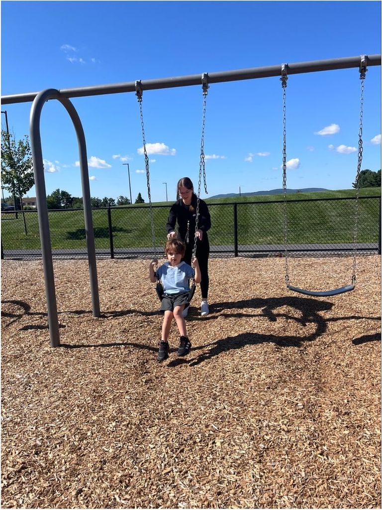 A young student on the swings