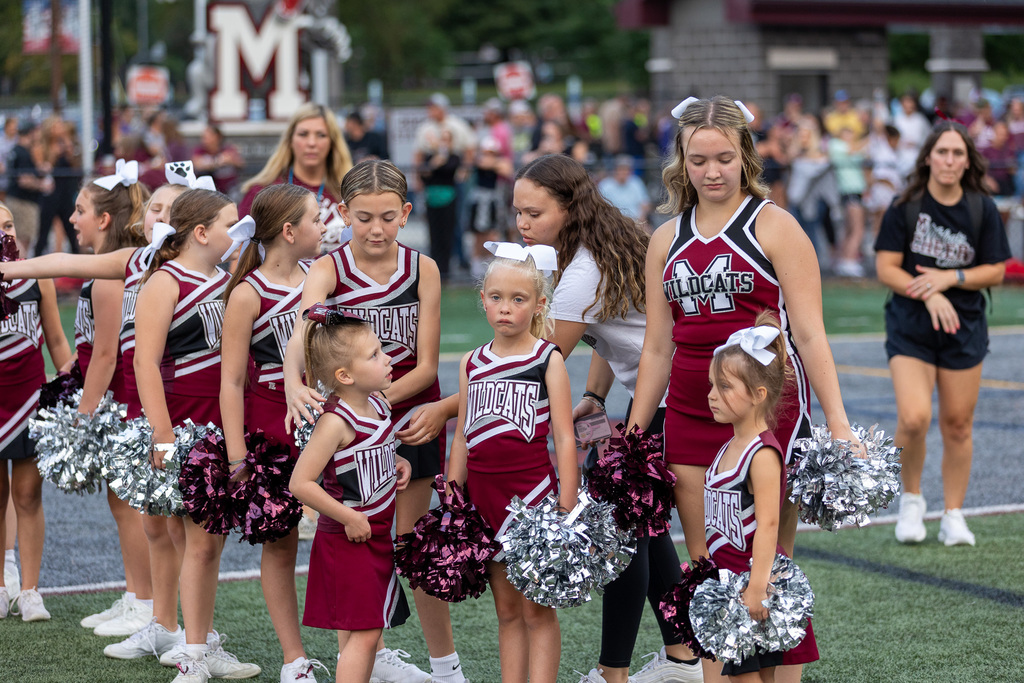 Youth cheerleaders at a game