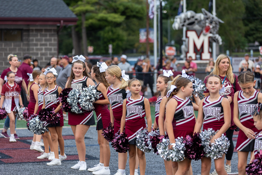Youth cheerleaders at a game