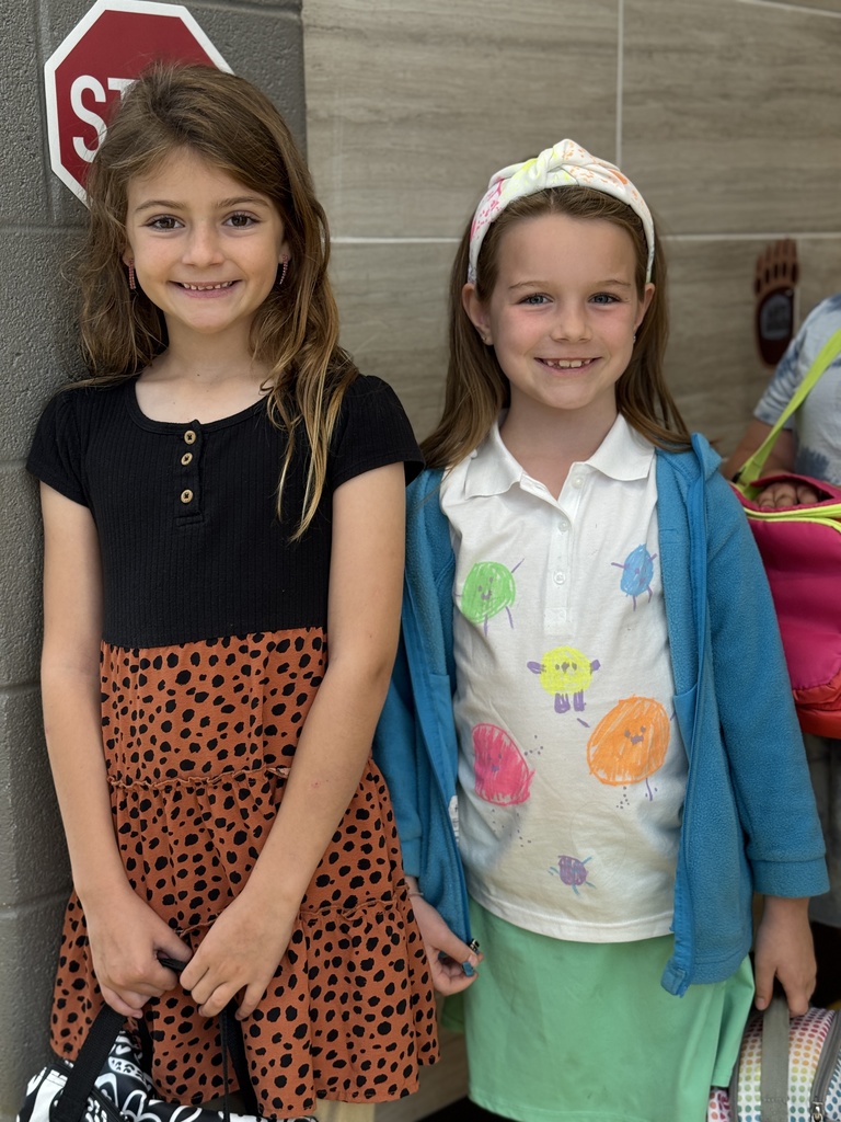 Friends showing off dot themed clothes