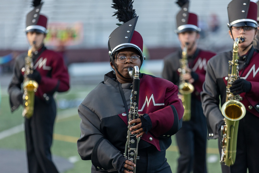 Members of the marching band playing during a show