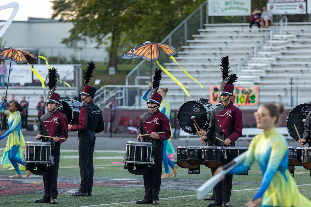 Members of the marching band playing during a show
