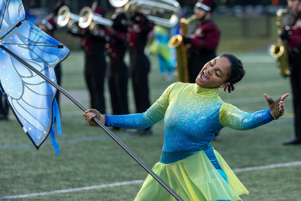 A color guard member performing during a show