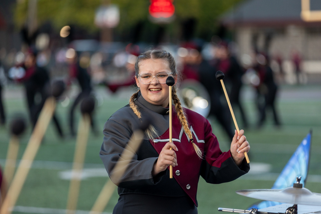 Members of the marching band playing during a show