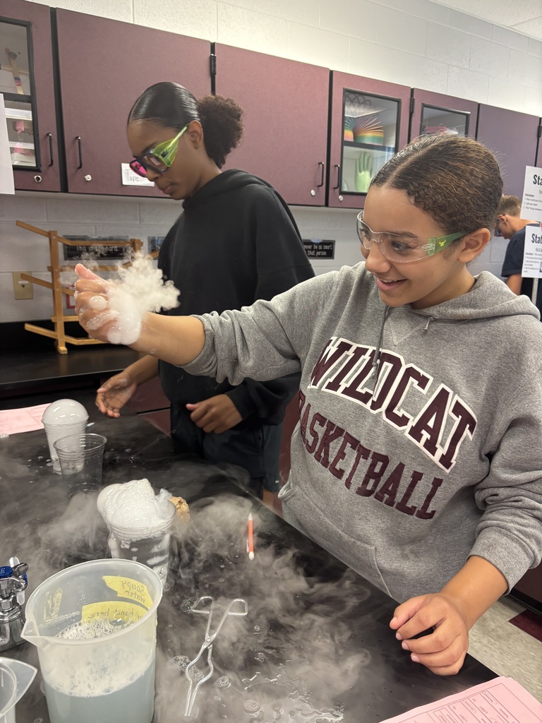 Students using dry ice in a middle school science lab.