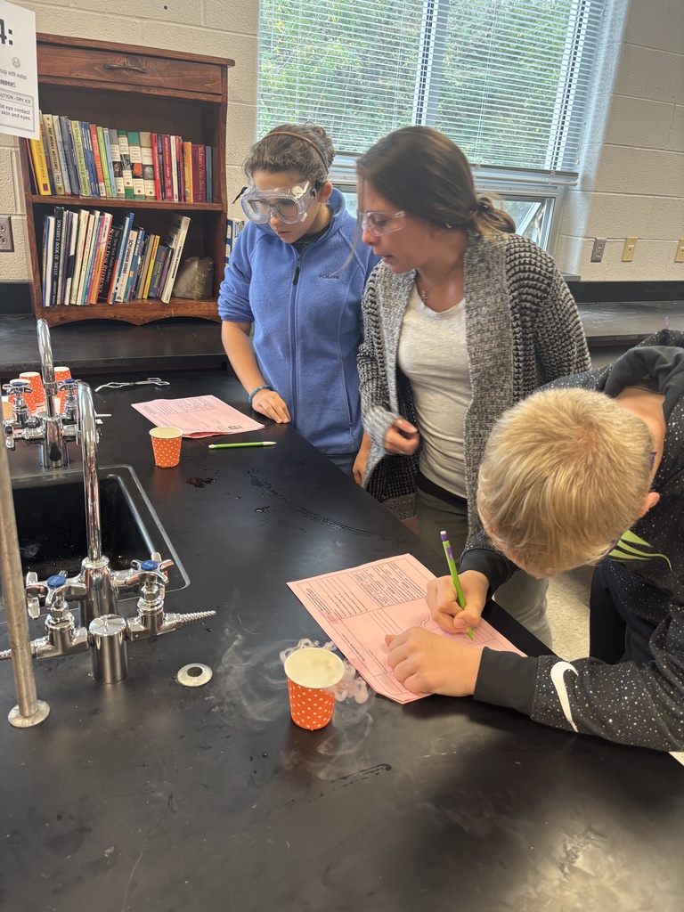 Students using dry ice in a middle school science lab.