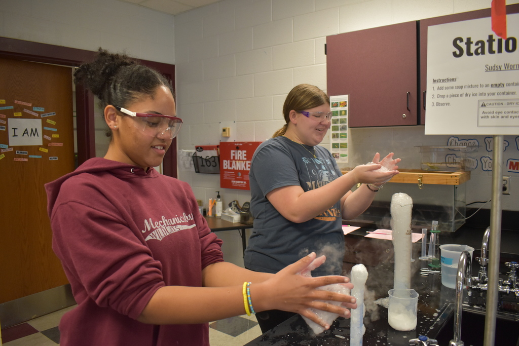 Students using dry ice in a middle school science lab.