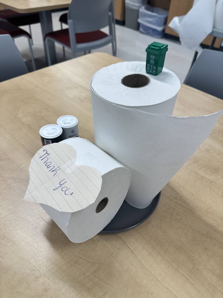 Toilet paper and paper towels with a thank you note.