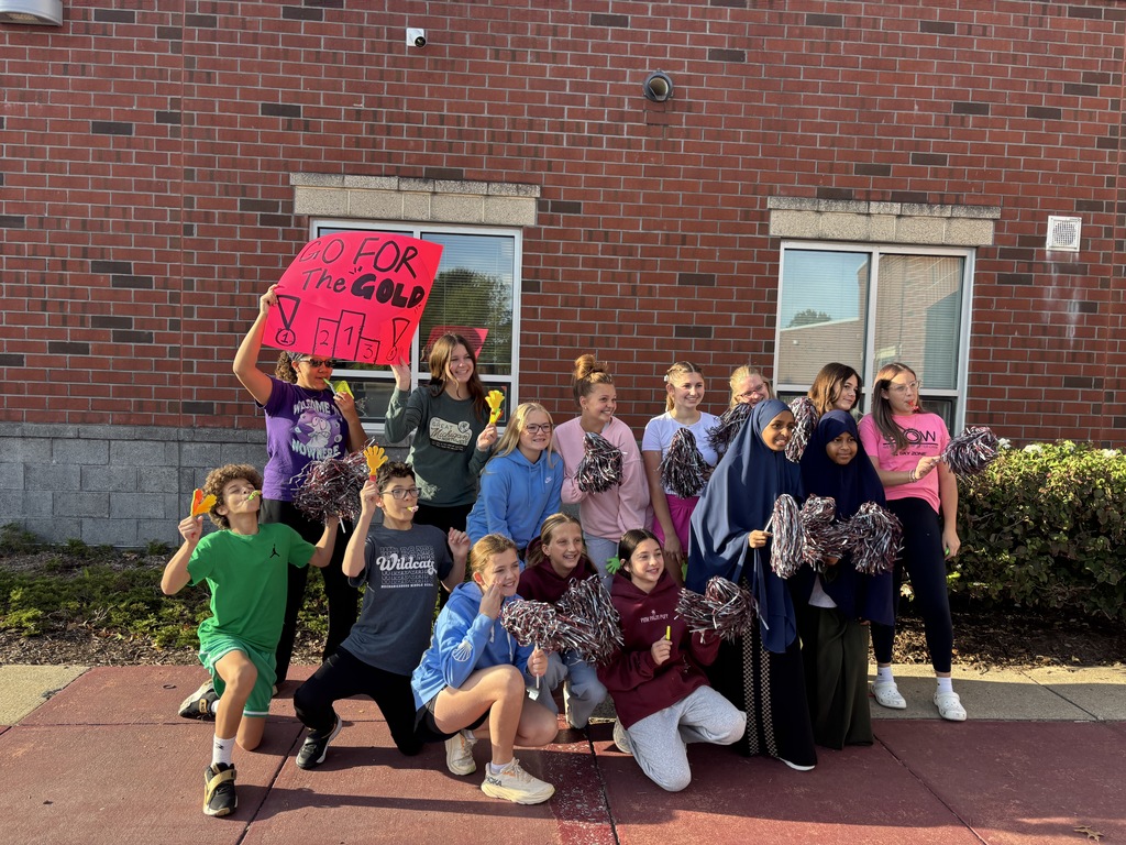 Group of student celebrating special olympians.