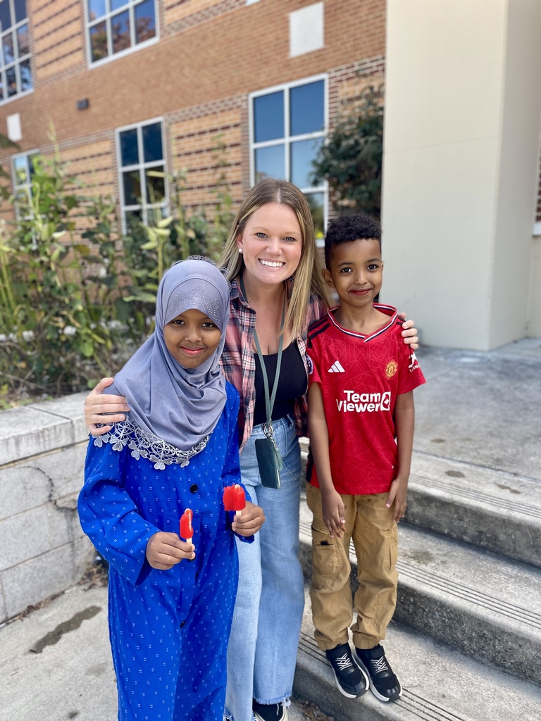 Staff with students holding popsicles