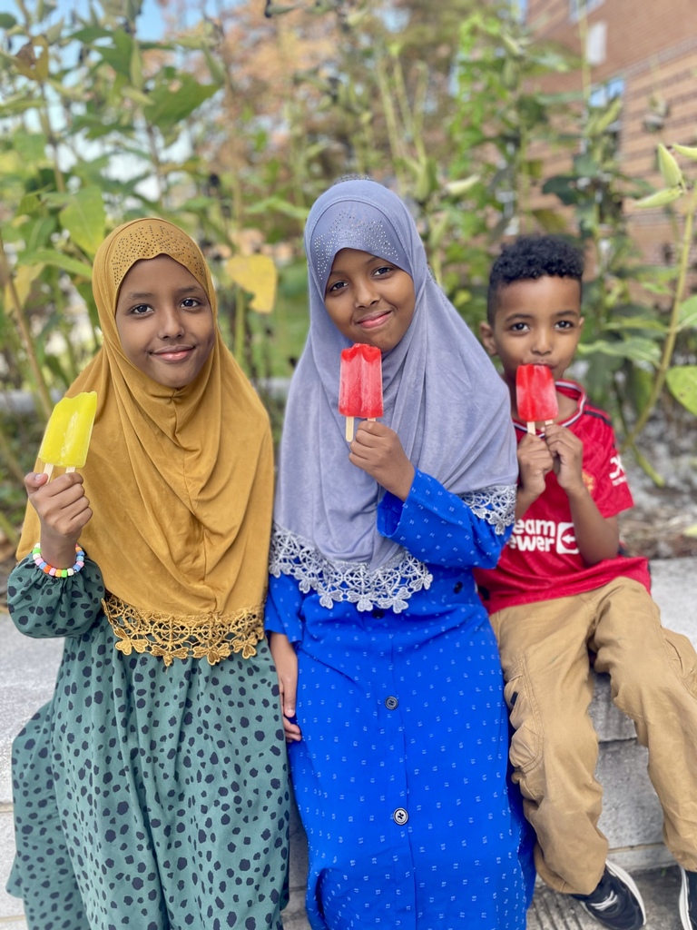 Students enjoying popsicles.