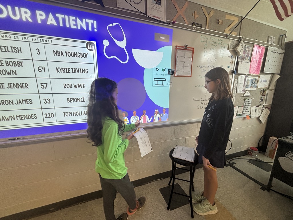 Students in class using math to "save" patients