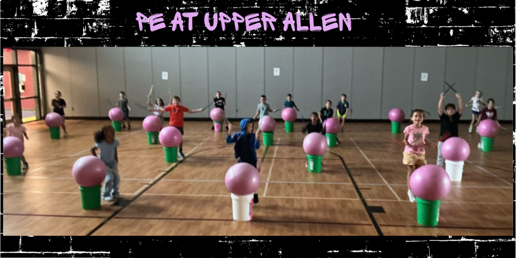 image of students drumming in PE class