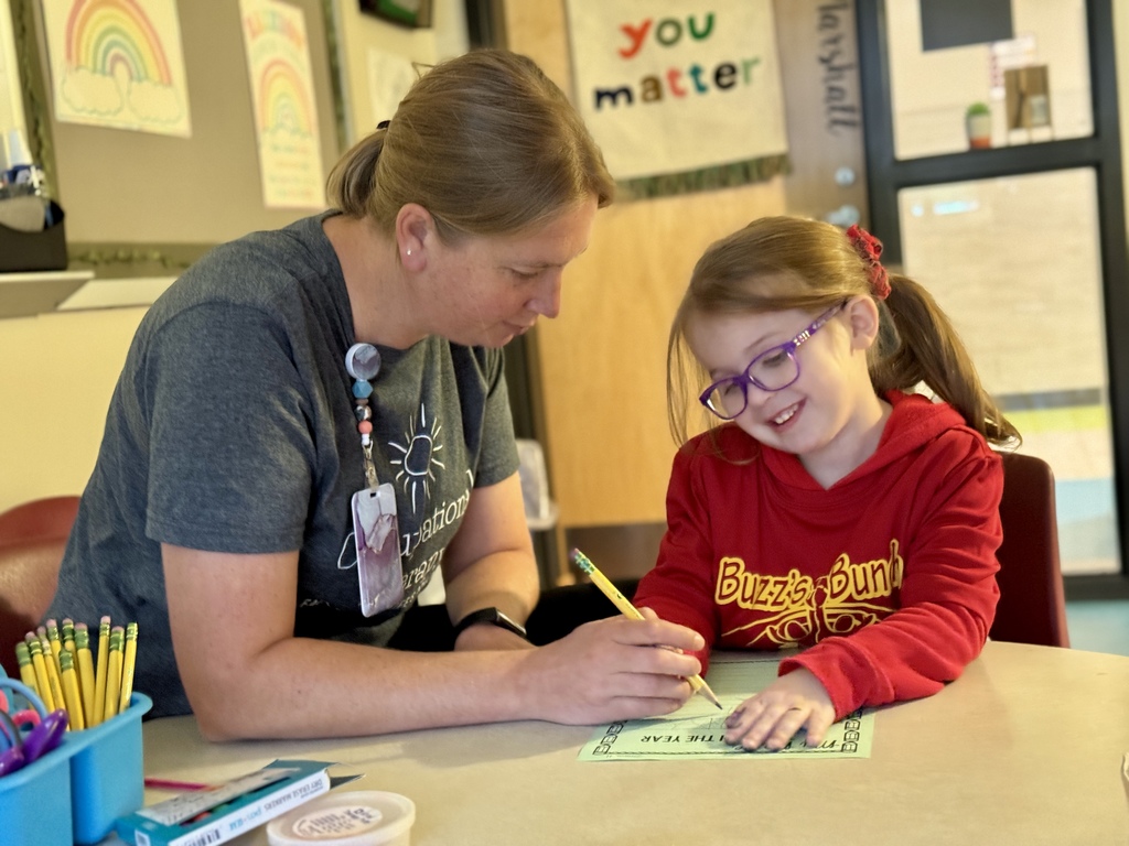 A young blind student learning to write.