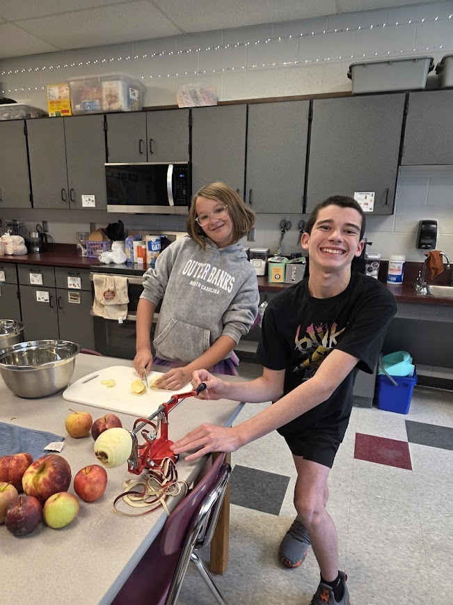 Students peel apples