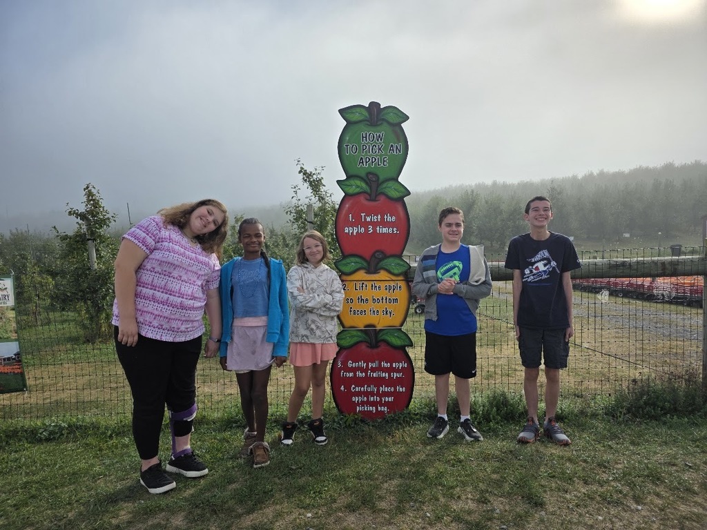 Students learn about apples at a local orchard.