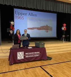 photo of mr mcintosh and dana padfield in front of the time capsule
