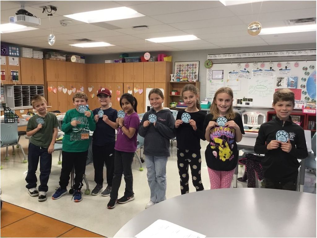 photo of a group of students receiving a paw print in mrs king's class