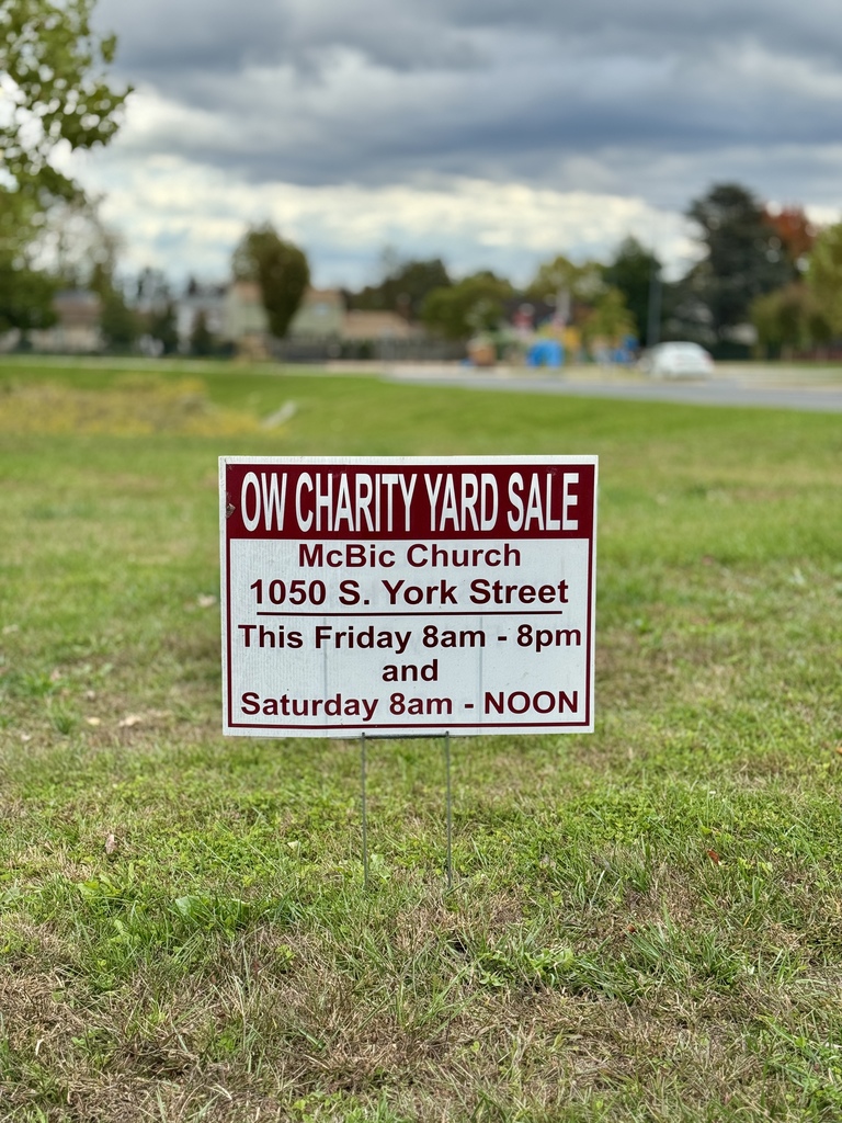 Photo of a yard sign advertising a charity yard sale, as described in our  post caption.