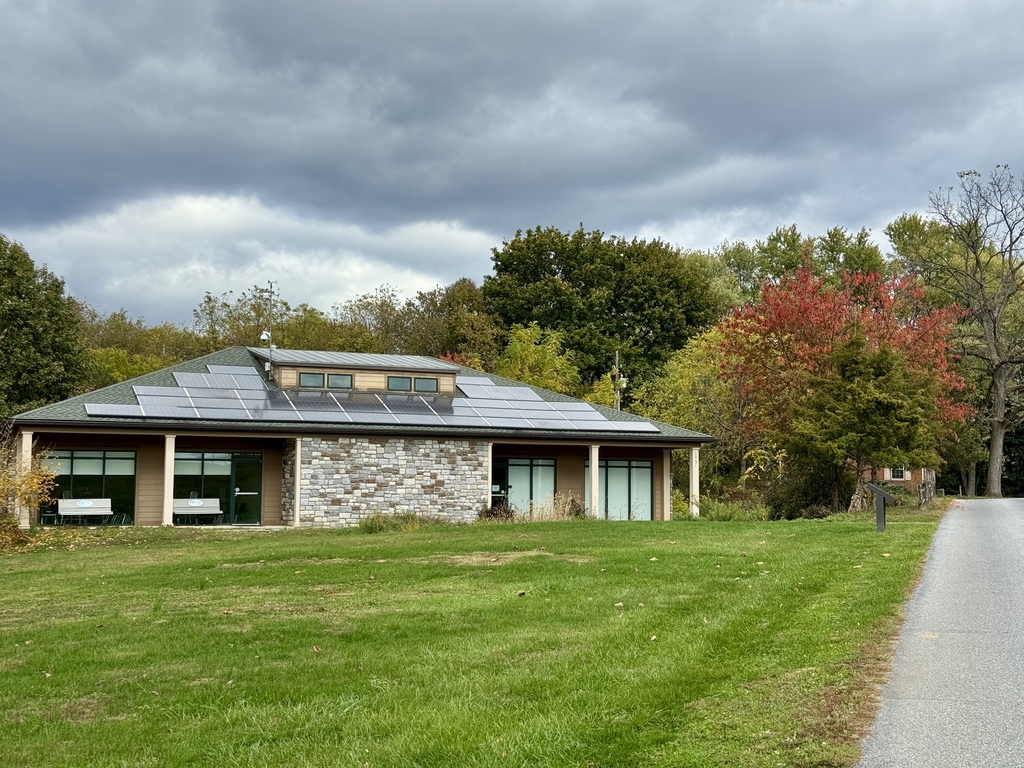 A building surrounded by fall foliage.