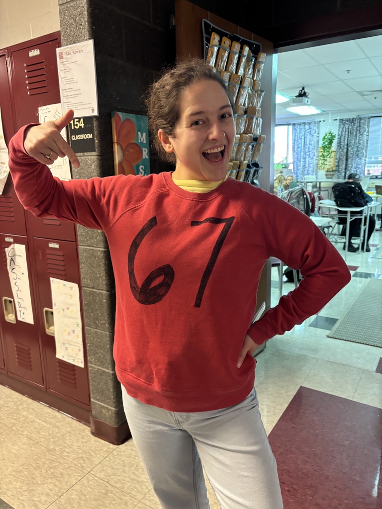 A teacher in a 6-7 outfit.