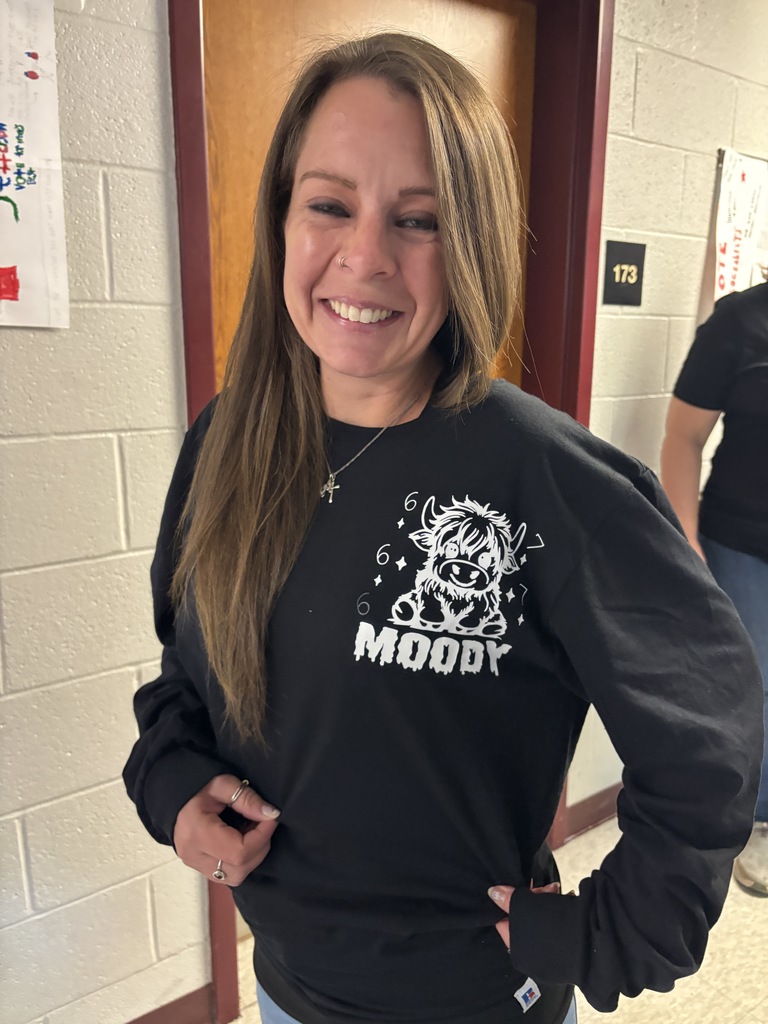 A teacher in a 6-7 outfit.