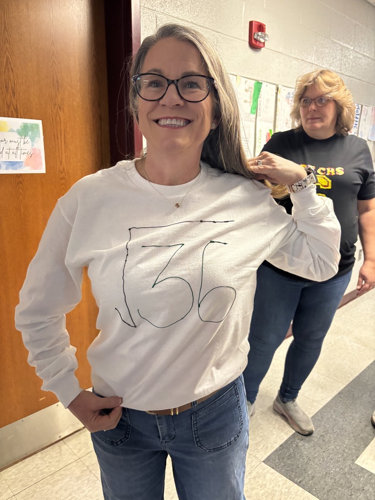 A teacher in a 6-7 outfit.