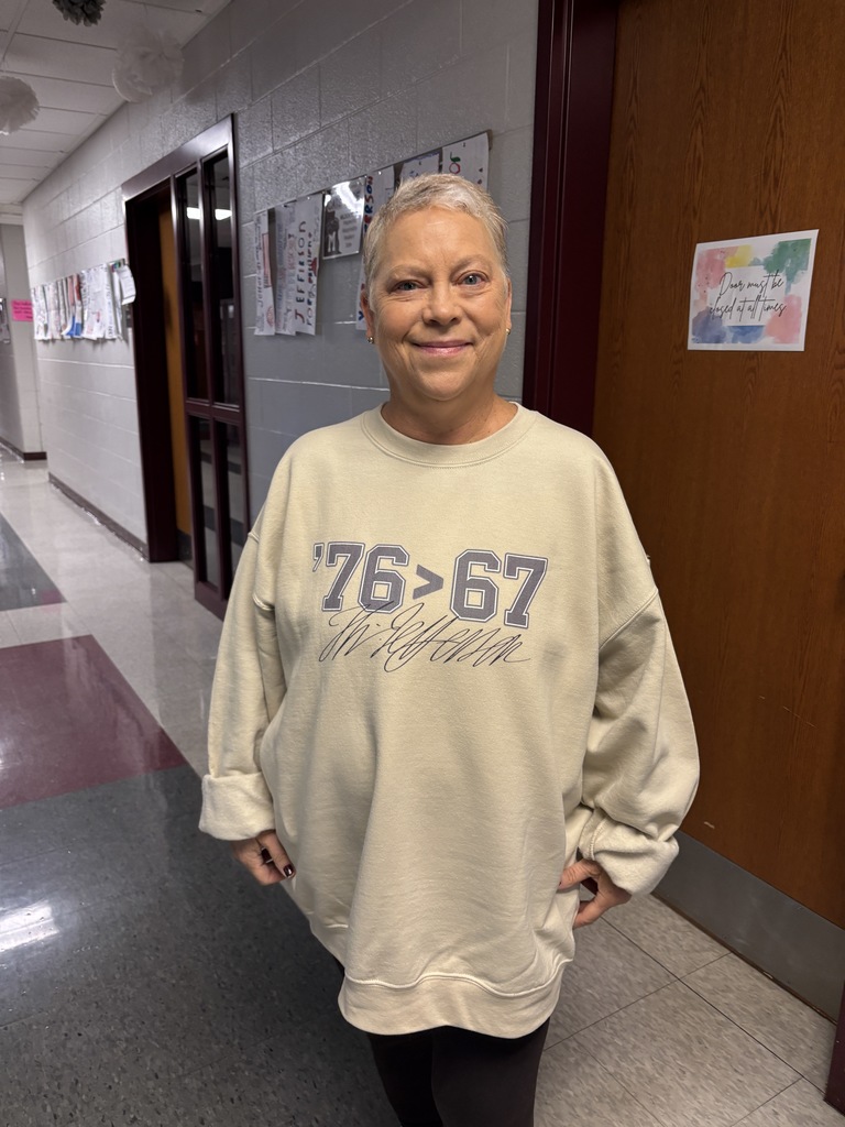 A teacher in a 6-7 outfit.