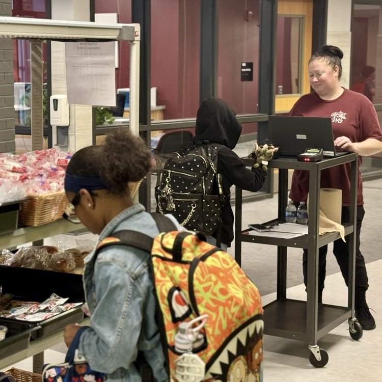 a young student picks breakfast items
