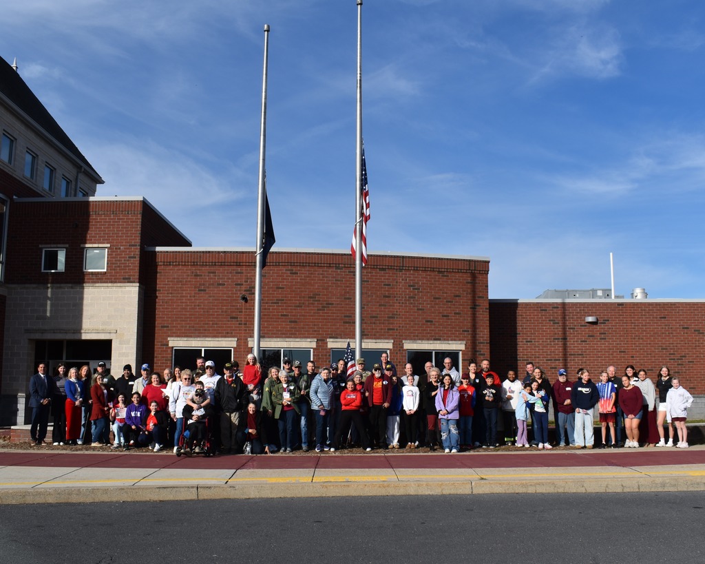 A group photo of veterans and their family members.
