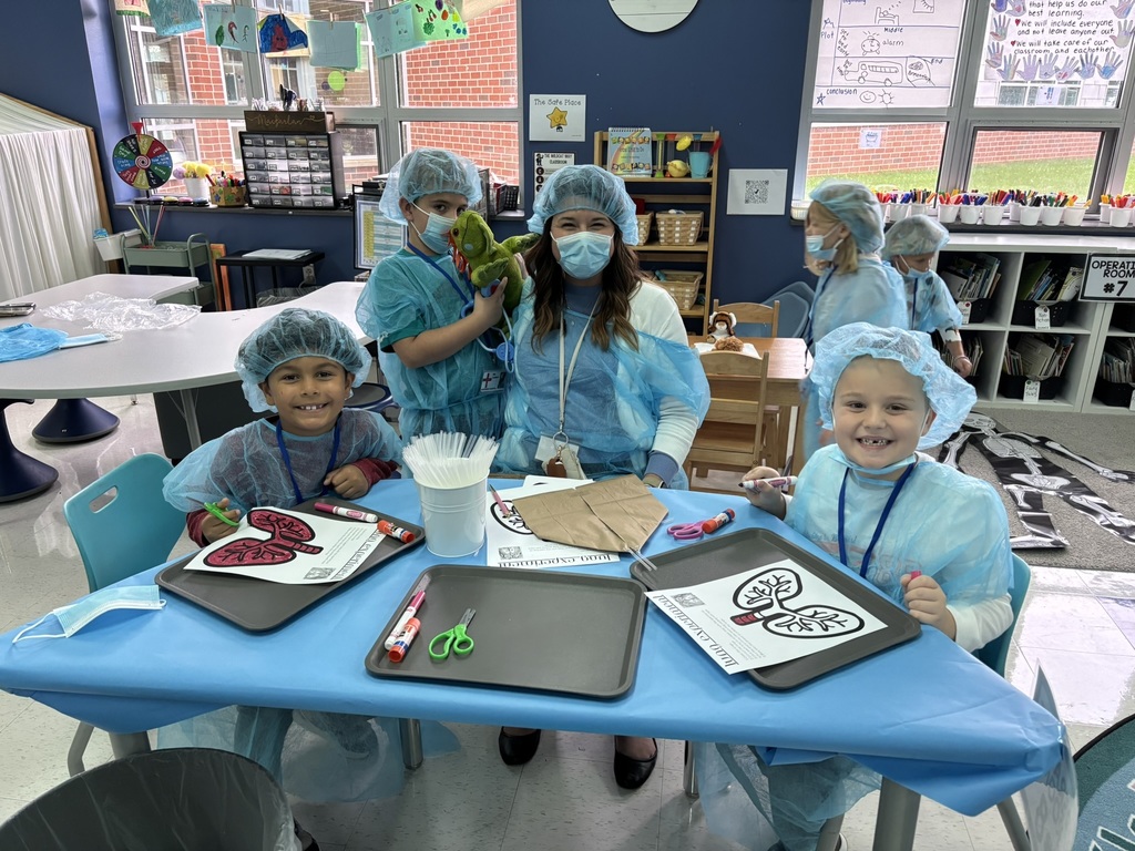Students dressed as doctors for a classroom activity.