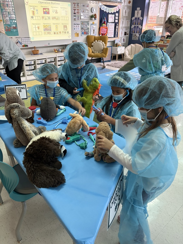 Students dressed as doctors for a classroom activity.