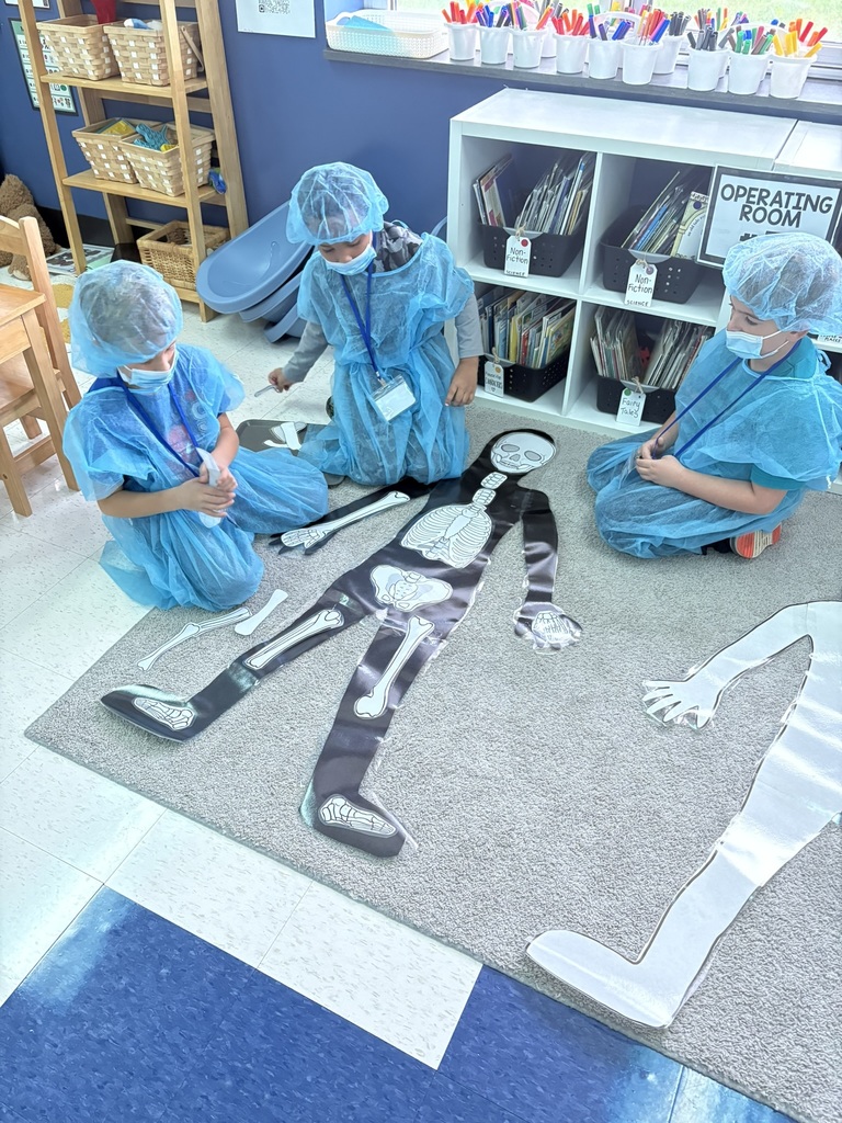 Students dressed as doctors for a classroom activity.