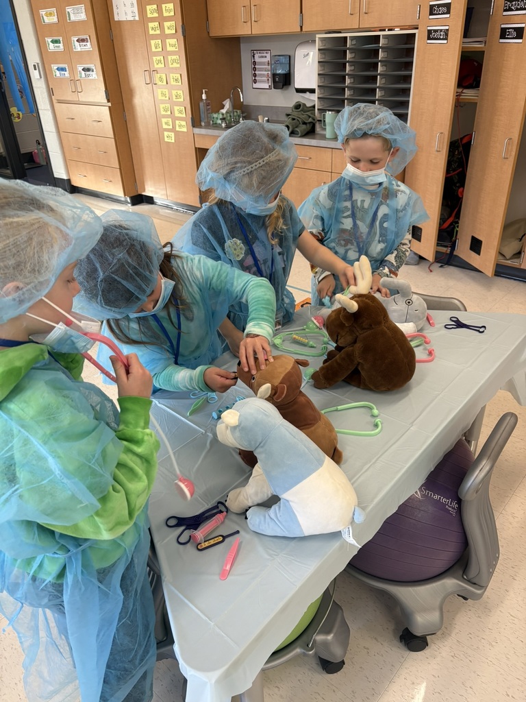 Students dressed as doctors for a classroom activity.