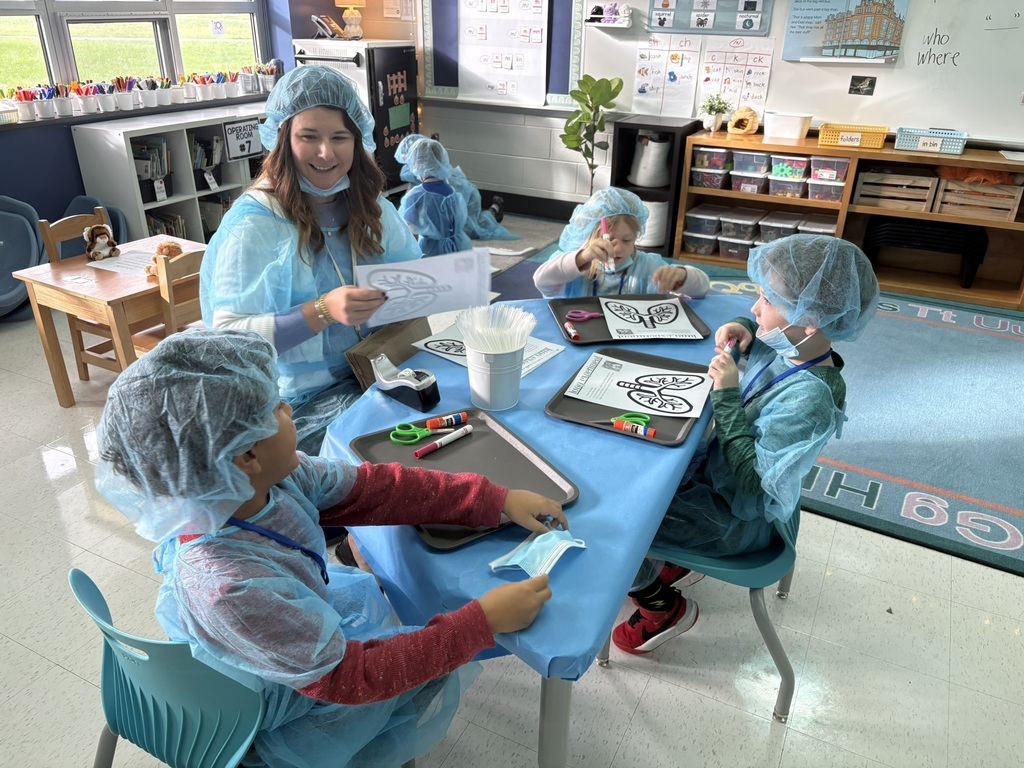 Students dressed as doctors for a classroom activity.